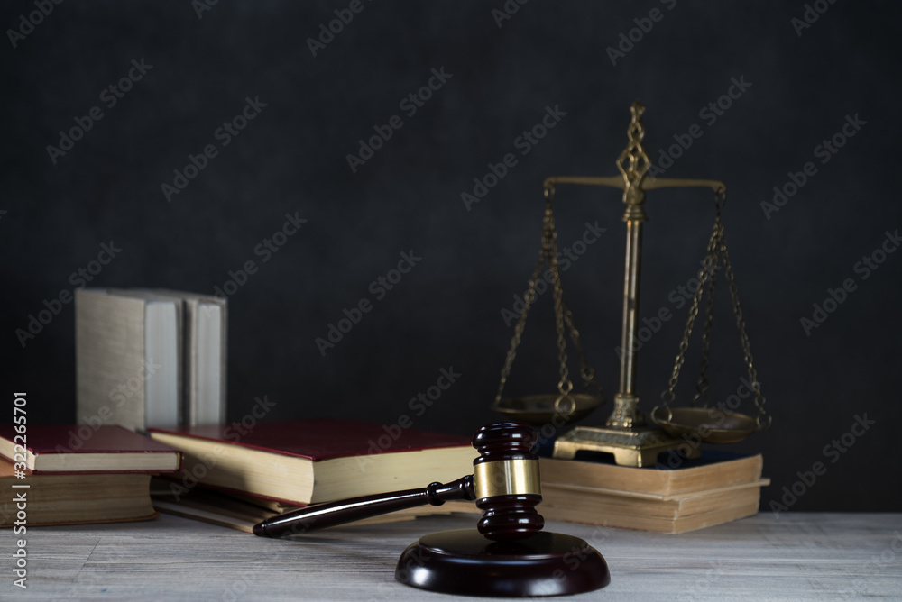 Law and Justice symbols over black background Law and Justice symbols over black background