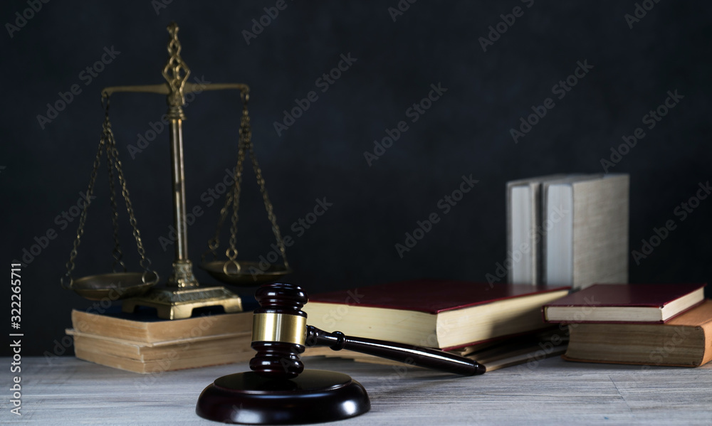 Law and Justice symbols over black background Law and Justice symbols over black background