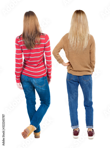 Back view of two woman in sweater.