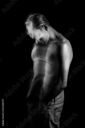 lyrical romantic guy bowed his head. depressed pensive mood. ghosts from the past. monochrome black and white stylish naked torso young sexy man portrait. Creative design