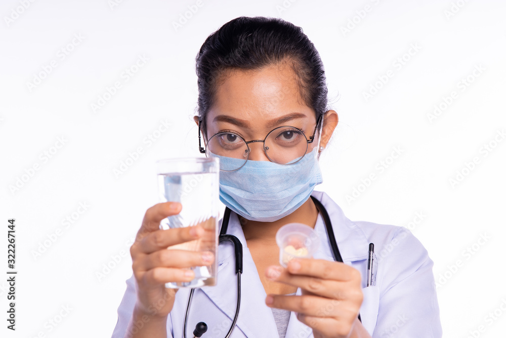 Doctors wear masks while showing medicine and water Doctors wear masks while showing medicine and water