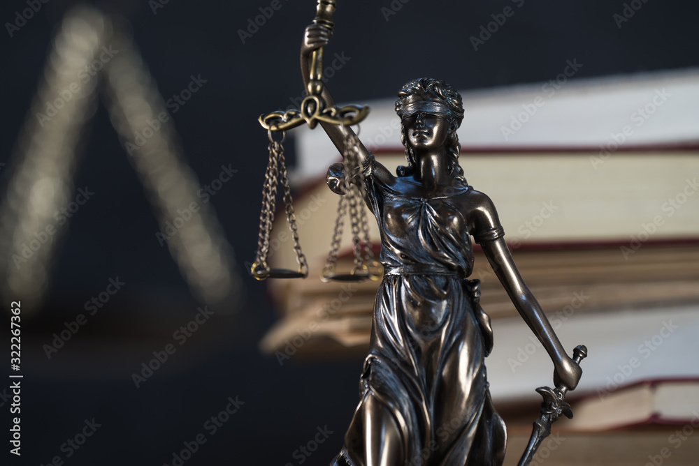 Law and Justice symbols over black background Law and Justice symbols over black background