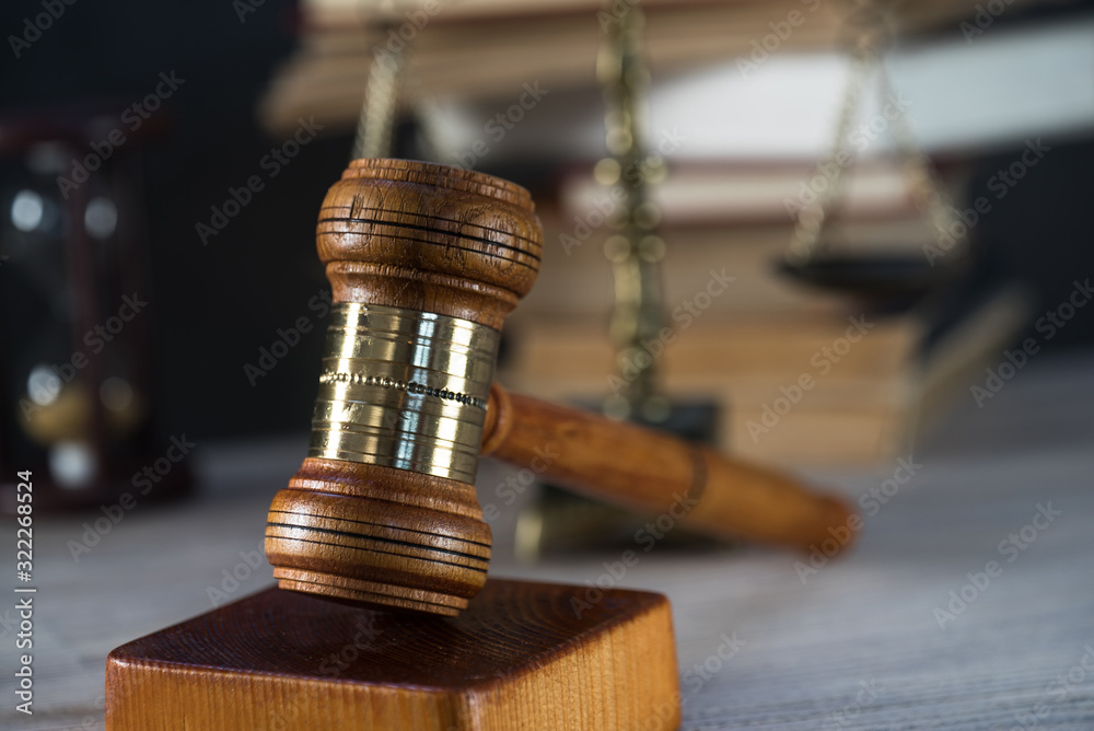 Law and Justice symbols over black background Law and Justice symbols over black background