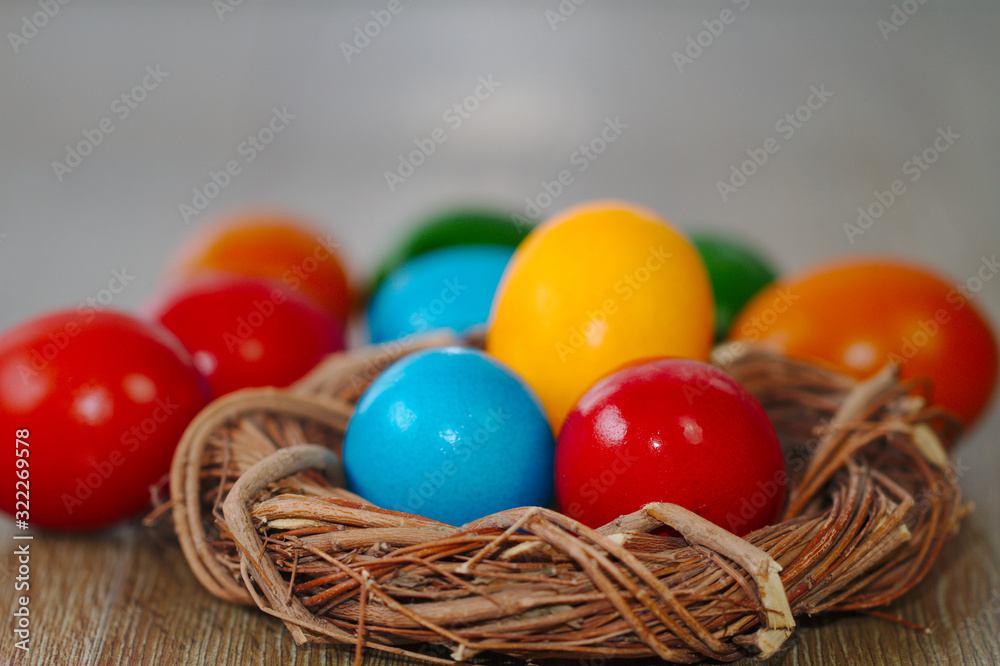 Small wicker nest with easter eggs Small wicker nest with easter eggs