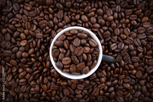 A cup filled with coffee grains.