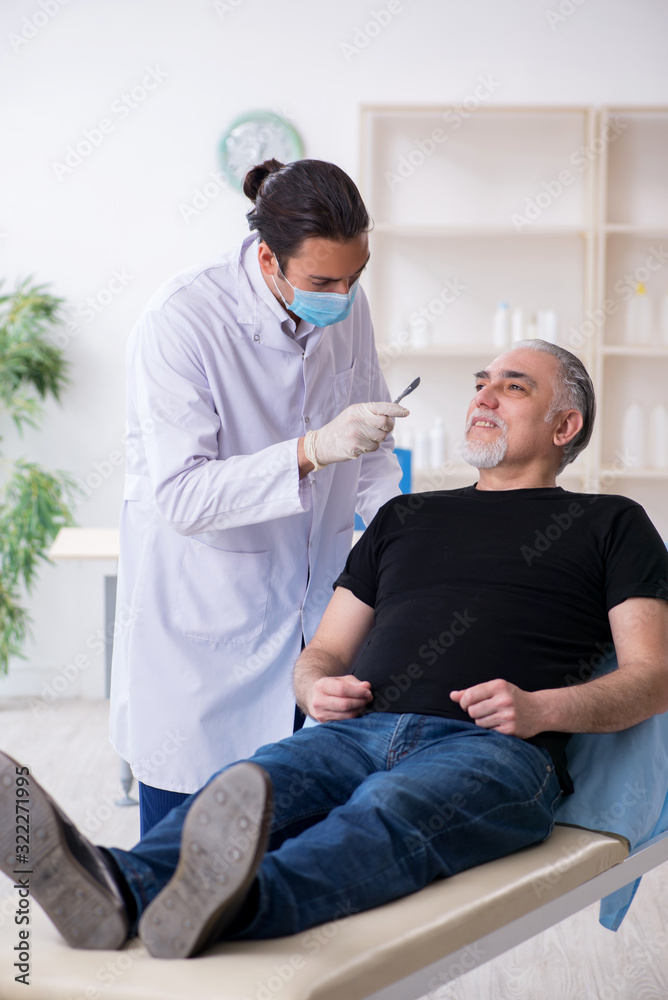 Old man visiting young doctor for plastic surgery Old man visiting young doctor for plastic surgery