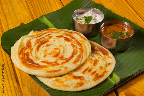 Kerala parotta, popularly known as paratha or porotta, is a delicacy from the state of Kerala photo