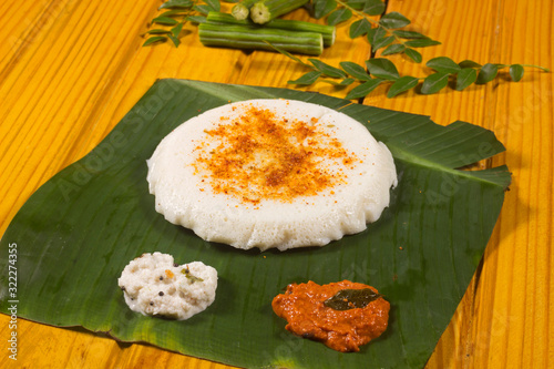 Thick spongy dosas served together with coconut chutney and sagu photo