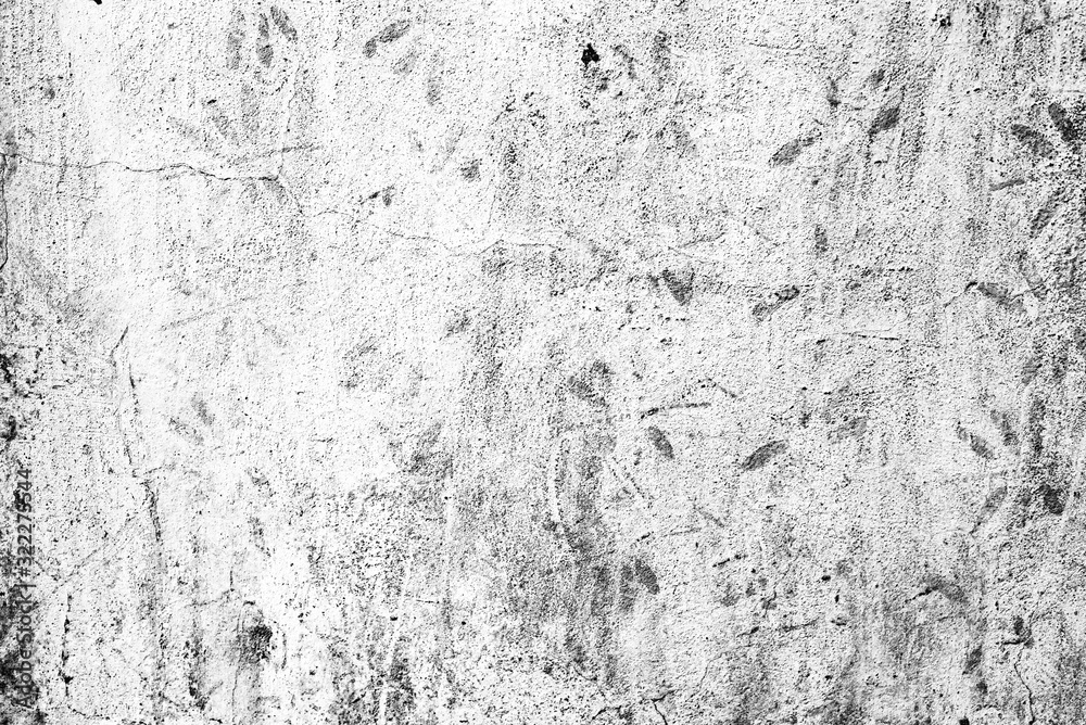 Texture of a concrete wall with cracks and scratches which can be used as a background Texture of a concrete wall with cracks and scratches which can be used as a background