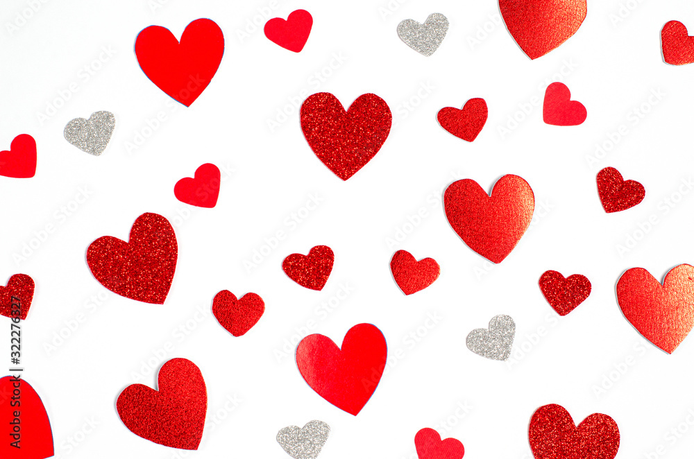 Valentine's day concept. Background from different bright red hearts on a white background