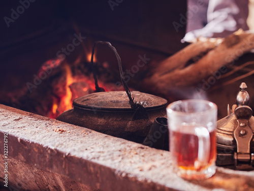 Canvas-taulu Traditional bedouin tea on fire in the Wadi Rum desert, Jordan