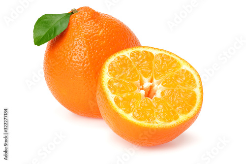 Orange clementine or minneola tangelo with slices and green leaves isolated on white background. Tangerine. Citrus fruit.