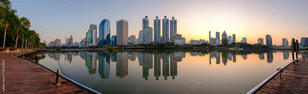 Fototapeta premium Bangkok city downtown at dawn with reflection of skyline