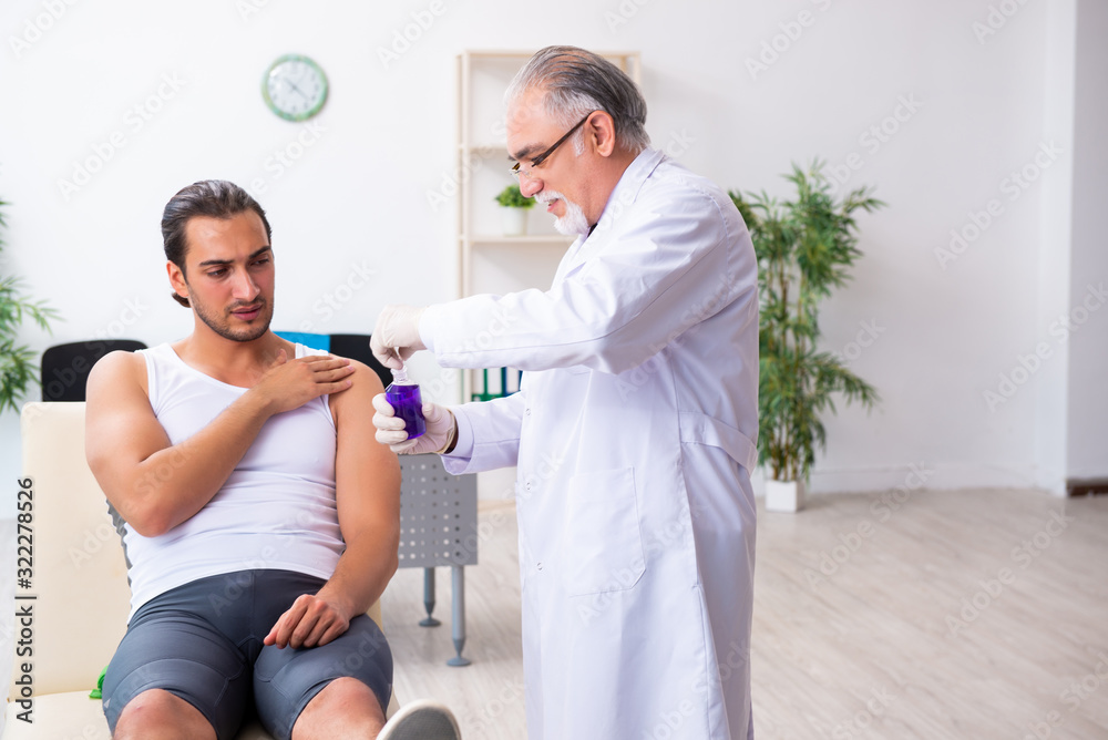 Young male patient visiting experienced doctor Young male patient visiting experienced doctor