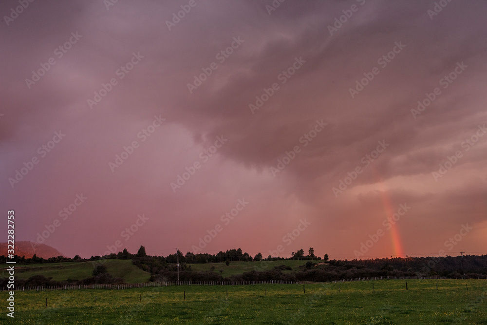 Tongariro National Park New Zealand. Rainbow. Sunset sky