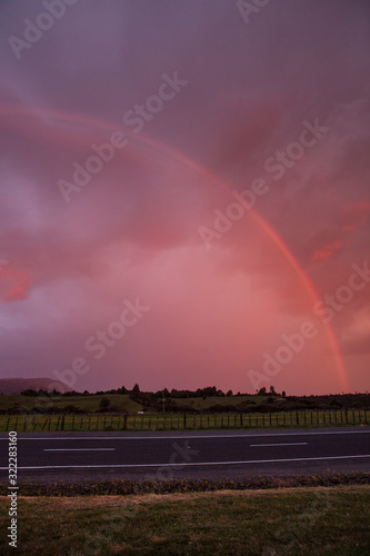Tongariro National Park New Zealand. Rainbow. Sunset sky
