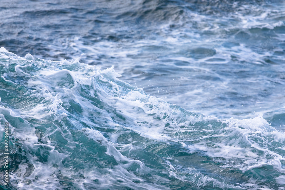 White crest of a sea wave. Selective focus. Shallow depth of field