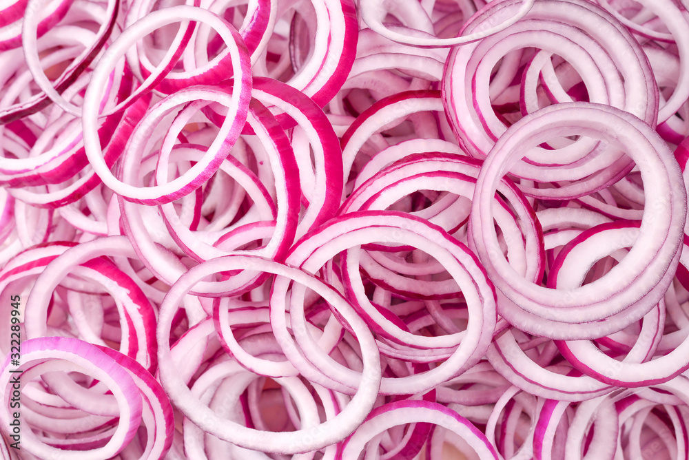 Onion rings as a background. Top view.