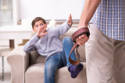 Father beating and punishing his sone