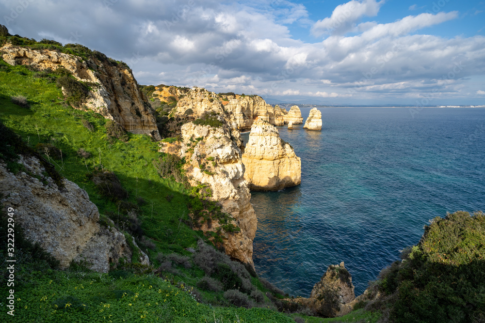 Scenic natural cliff formations of Algarve coastline with turquoise water at Ponta da Piedade, in Algarve Portugal