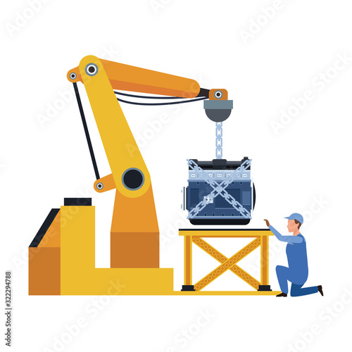 industrial arm holding a car engine and mechanic supervising