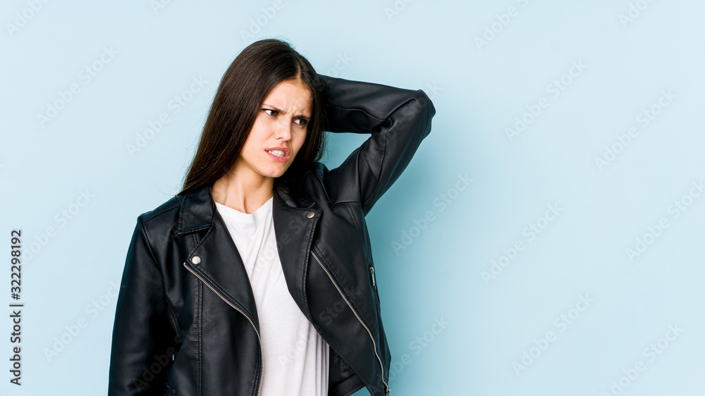 Young caucasian woman isolated on blue background tired and very sleepy keeping hand on head. Young caucasian woman isolated on blue background tired and very sleepy keeping hand on head.
