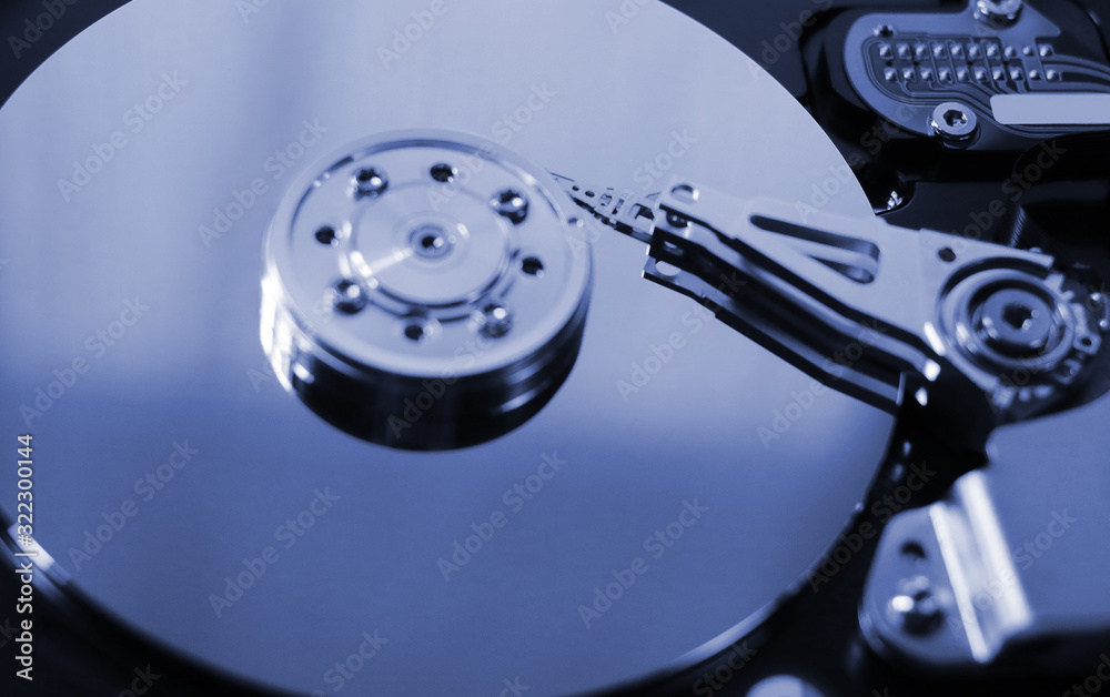 disassembled hard drive. computer component hdd with a mirror effect. close-up. disassembled hard drive. computer component hdd with a mirror effect. close-up.