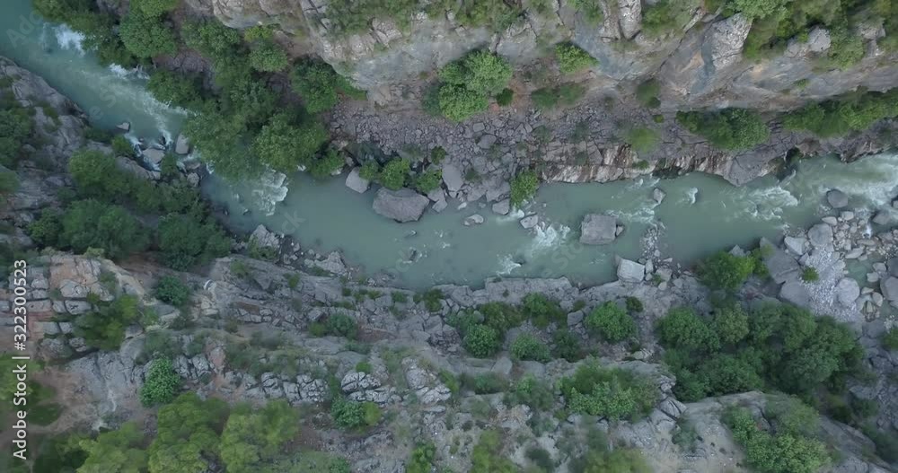 Top view on a rocky river in a canyon with trees around it, Koprulu, Turkey, 4k