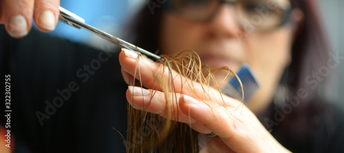 Hairdresser who is cutting hair