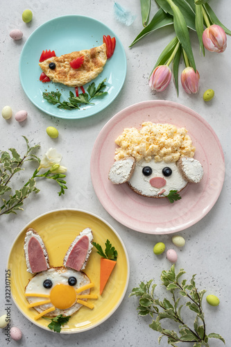 Colorful breakfast meal for kids. Funny Easter food art, top view.
