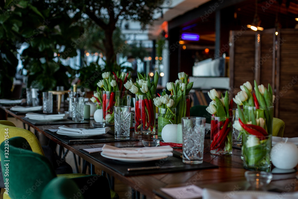 horizontal photo of a dining table decorated with candles and unusual flower arrangements horizontal photo of a dining table decorated with candles and unusual flower arrangements