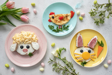 Colorful breakfast meal for kids. Funny Easter food art, top view.