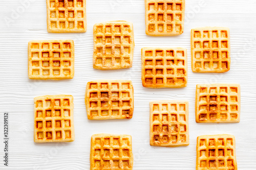 Belgian waffles pattern on white background top-down flat lay