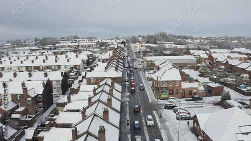 Aerial view heavy traffic on Anchor road Longton, a sudden snow blizzard in Stoke on Trent, dangerous driving conditions, cars travelling slowly, safely, West Midlands photo