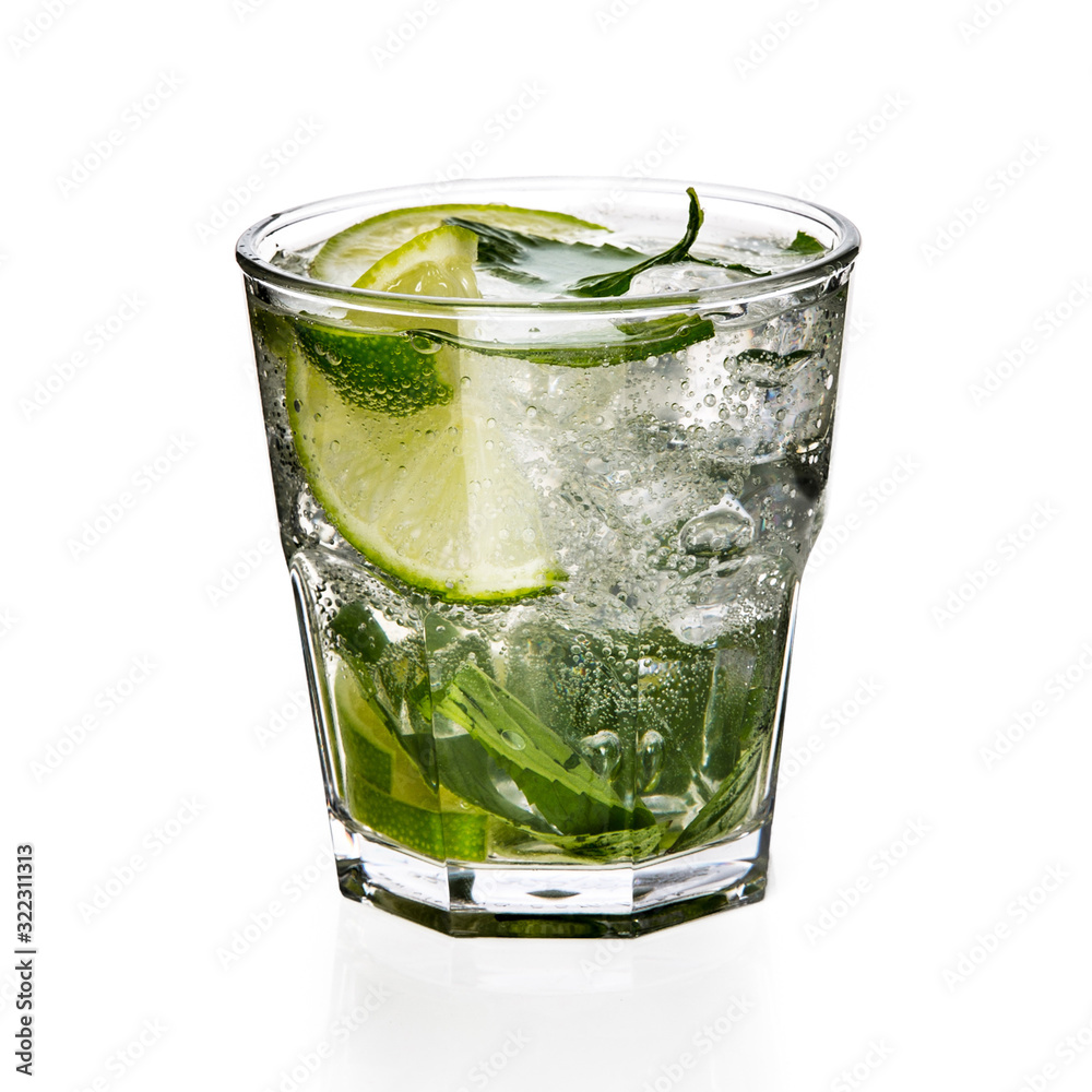 Glass of mojito with lime, mint and ice isolated on white background. Glass of mojito with lime, mint and ice isolated on white background.