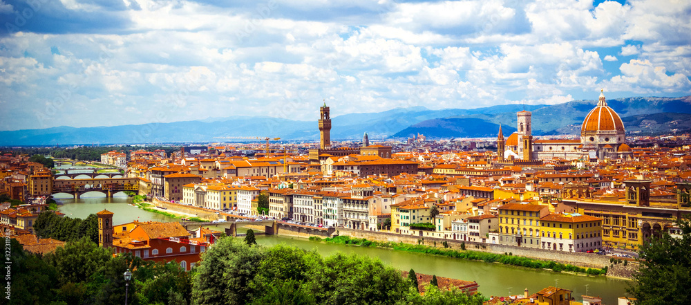 Panoramic view, aerial skyline of Florence Firenze Cathedral of Santa Maria del Fiore, Ponte Vecchio bridge over Arno River, Giotto Bell Tower. Summer cityscape banner. Florence, Tuscany, Italy