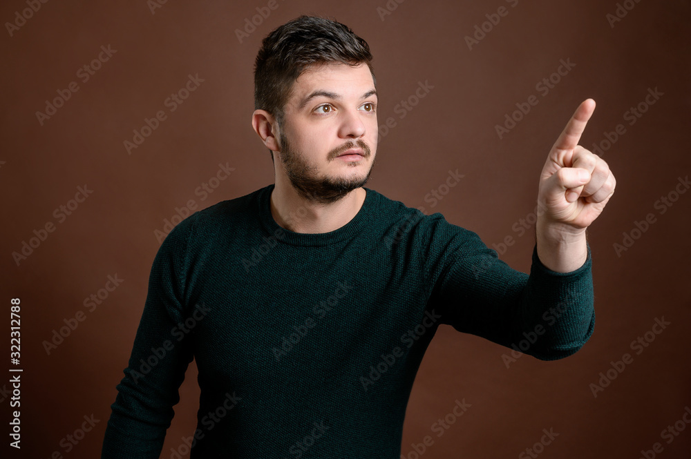 Fototapeta premium Young man pressing virtual button