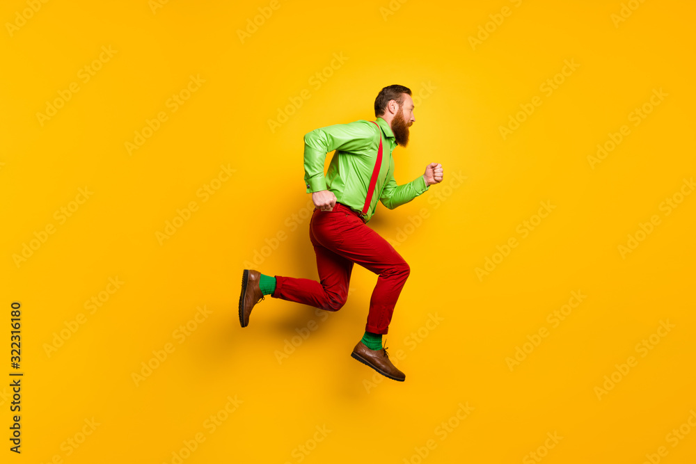 I need run faster. Full length profile side photo of focused irish gentleman jump hurry want buy shopping center discount wear good look outfit isolated over yellow color background