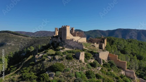Aerial panorama view of Alcala de Xivert (Alcalá de Chivert) medieval Templar knight castle ruins in Valencia province Spain