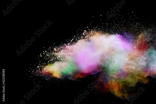 Abstract powder splatted background. Colorful powder explosion on black background. Colored cloud. Colorful dust explode. Paint Holi. © piyaphong