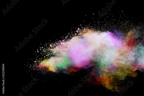 Abstract powder splatted background. Colorful powder explosion on black background. Colored cloud. Colorful dust explode. Paint Holi.