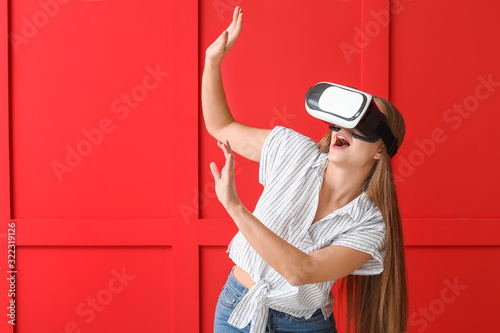 Young woman with VR glasses...
