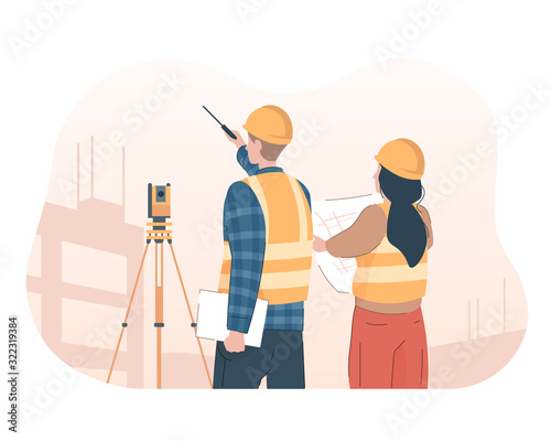 Surveyor engineer with theodolite looking at construction site