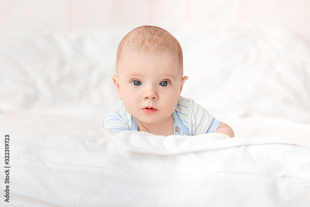 Portrait of cute little baby lying on bed Portrait of cute little baby lying on bed