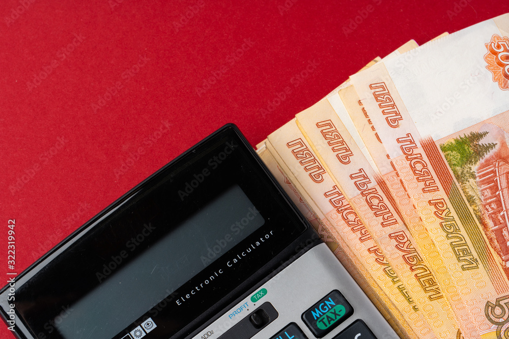 Close up photo of stack of Russian money rubles with calculator Close up photo of stack of Russian money rubles with calculator