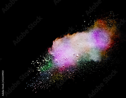 Abstract powder splatted background. Colorful powder explosion on black background. Colored cloud. Colorful dust explode. Paint Holi.