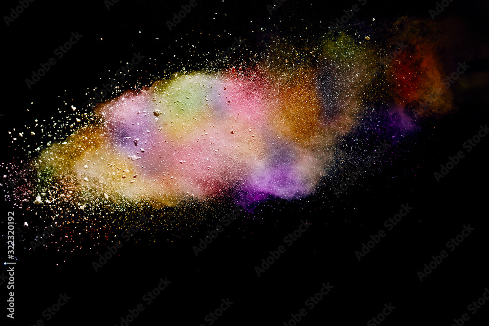 Abstract powder splatted background. Colorful powder explosion on black background. Colored cloud. Colorful dust explode. Paint Holi.