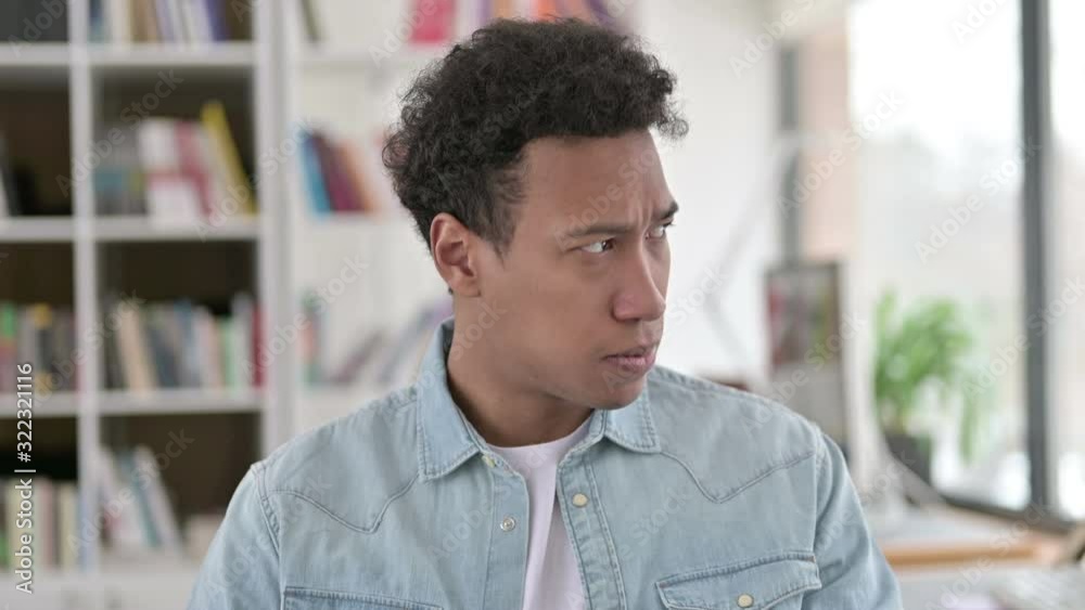 Saddened Young African American Man Reacting to Loss Saddened Young African American Man Reacting to Loss