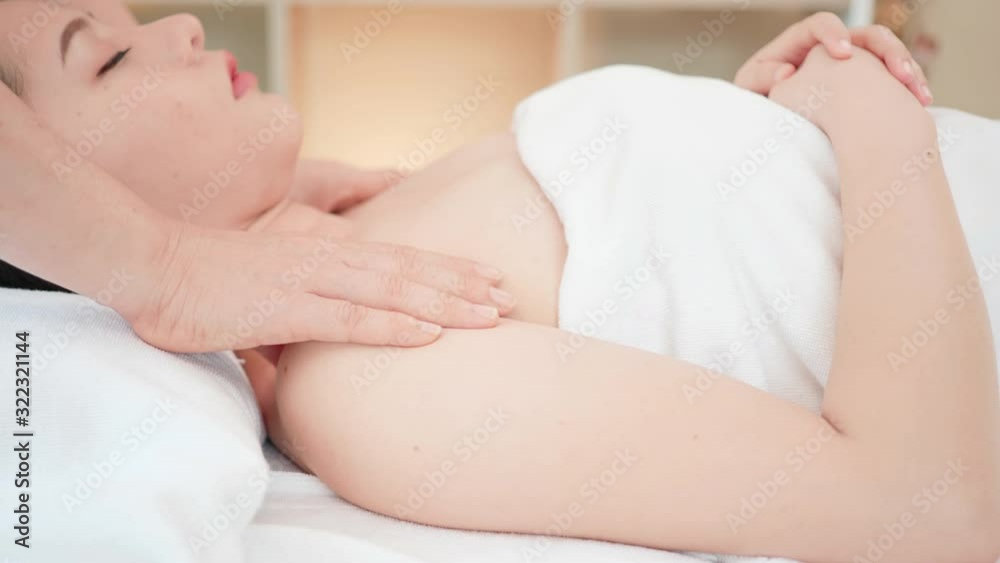Close up Young Asian woman getting spa massage treatment at beauty spa salon. Body massage, Relaxing massage, Spa skin and body care. Close up Young Asian woman getting spa massage treatment at beauty spa salon. Body massage, Relaxing massage, Spa skin and body care.