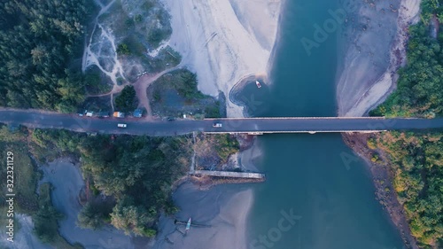 Aerial view of seaside bridge and vehicles photo